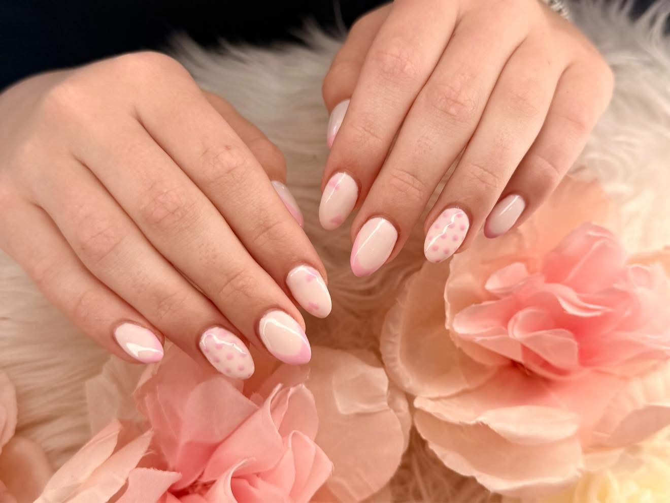 Soft pink French tips with dotted accents